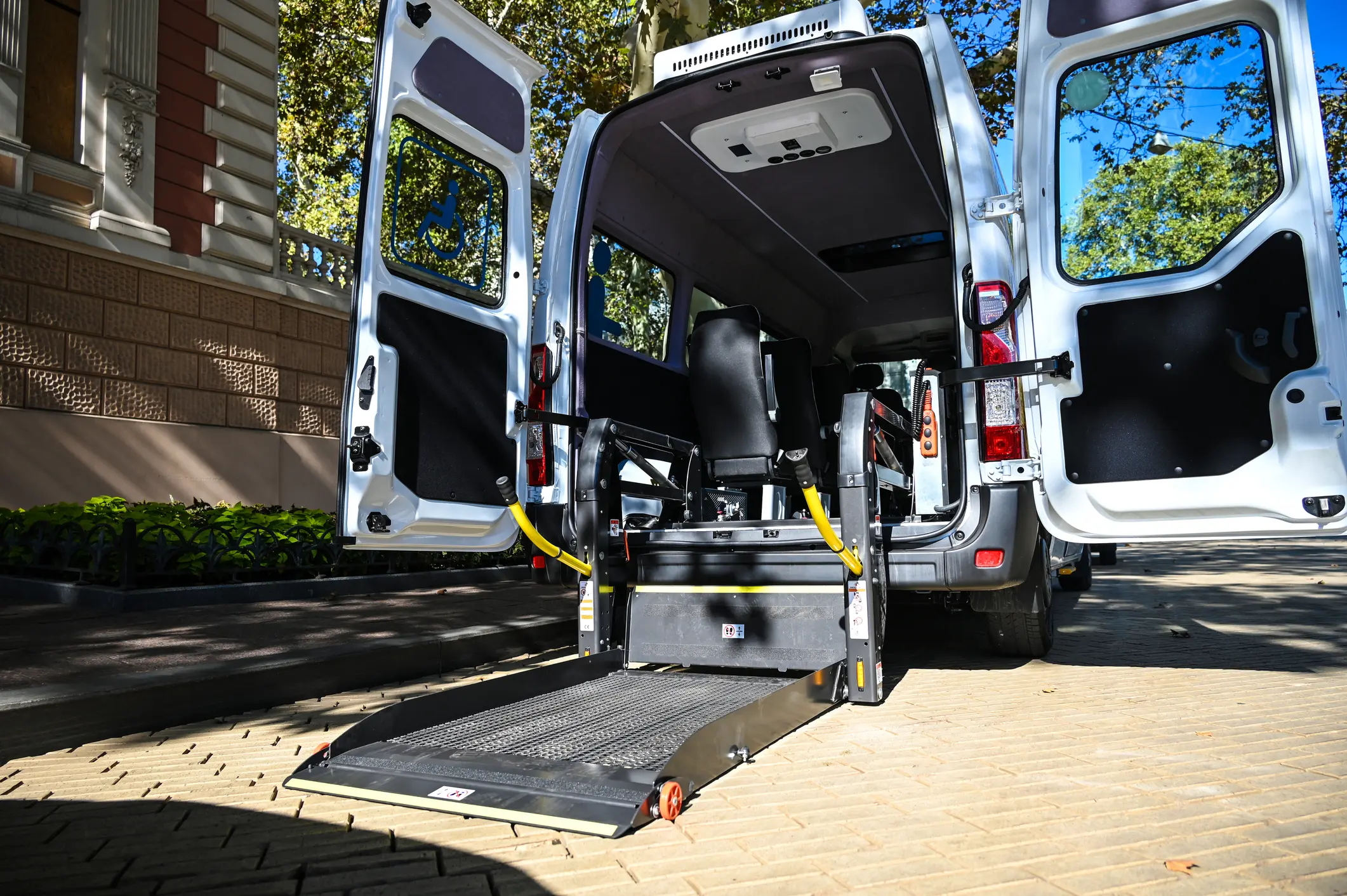 Open wheelchair-accessible van with ramp extended.